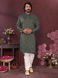 Men's green knee-length Smart Silk kurta with mirror embroidery details and matching pajama pants