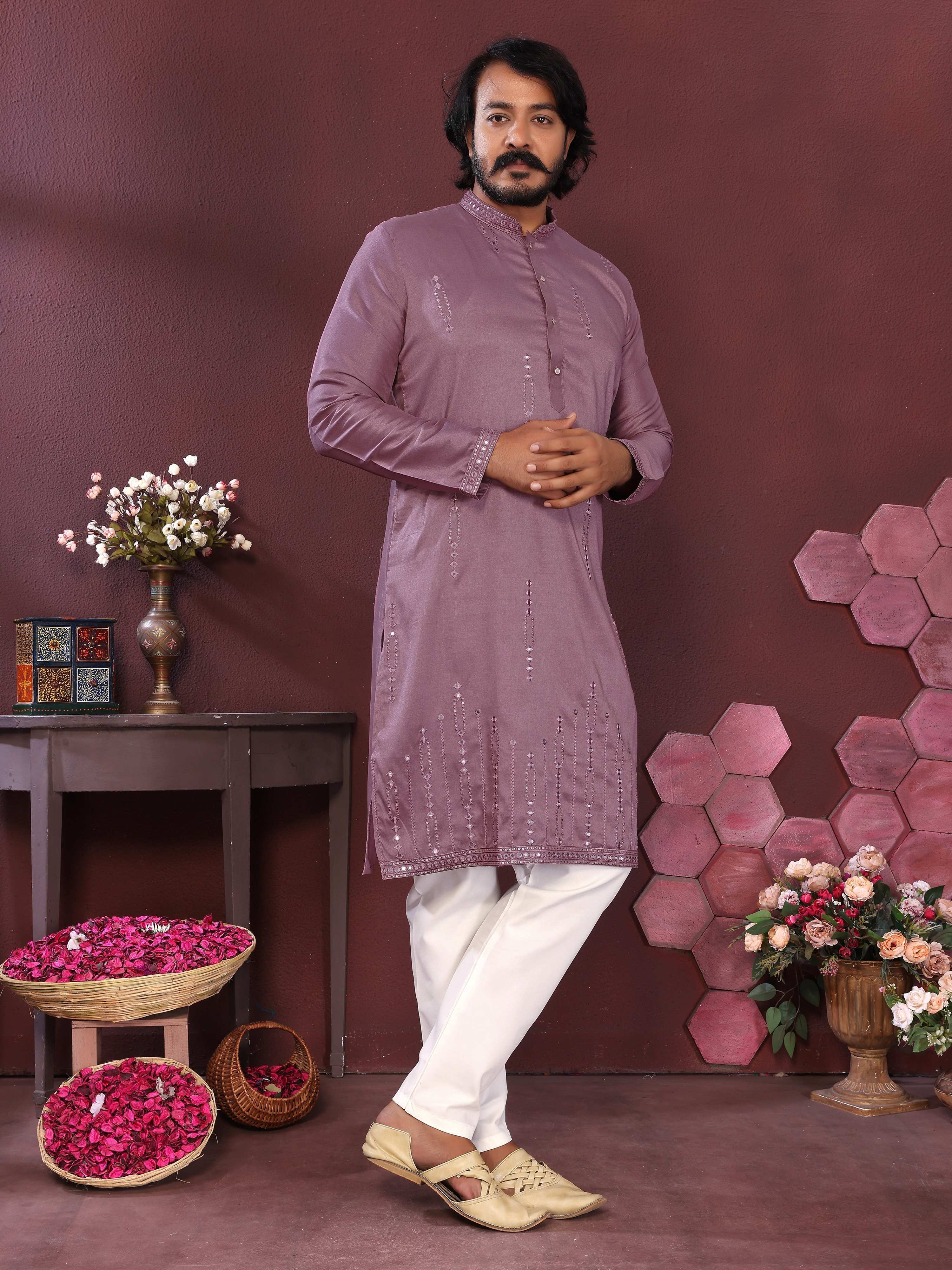 Men's purple kurta with mirror embroidery detailing paired with matching pajama pants.