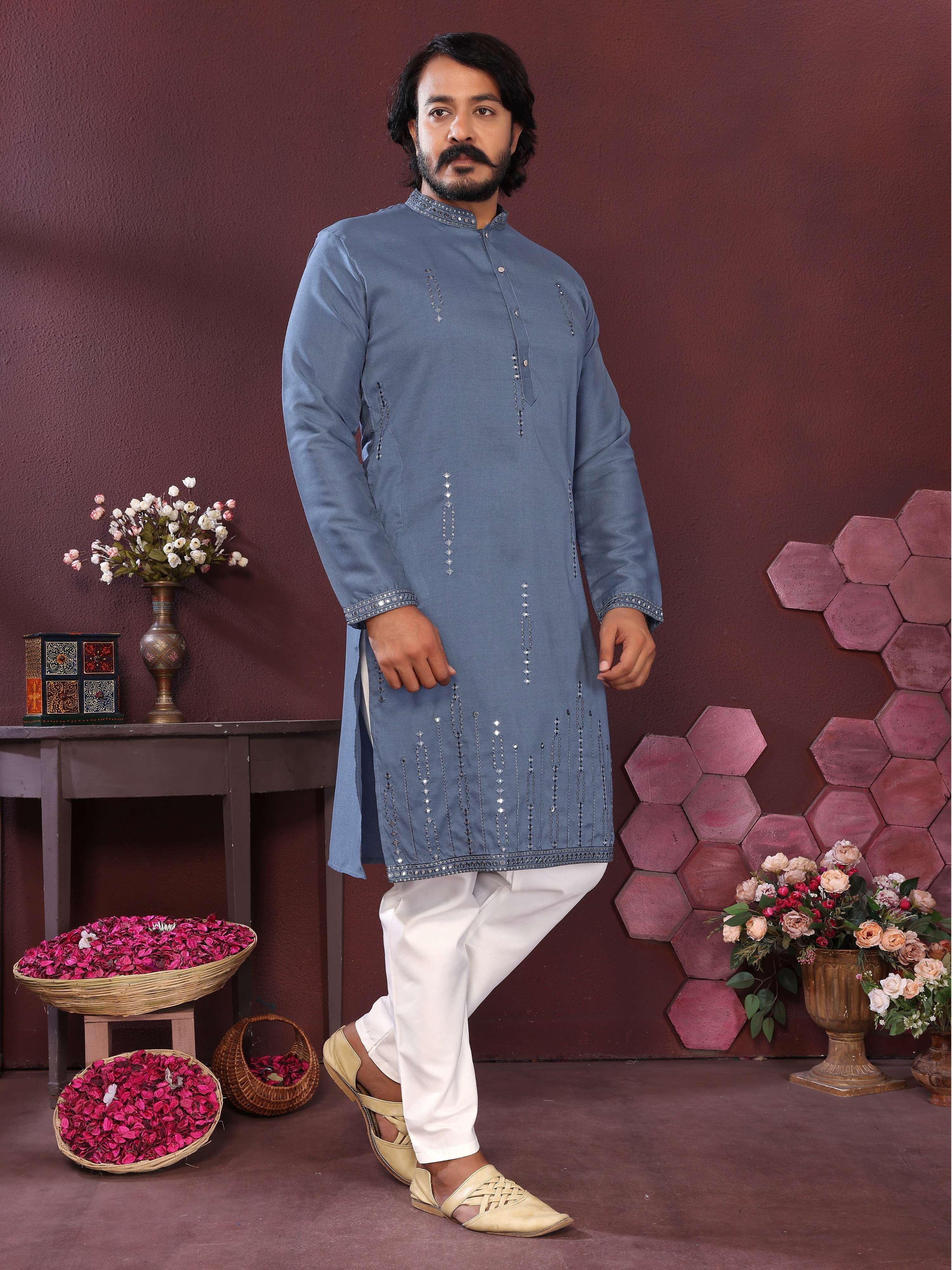 Men wearing a blue kurta with detailed mirror embroidery and matching pajamas