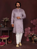 Baby boy wearing a purple sequins embroidered kurta with matching pajama