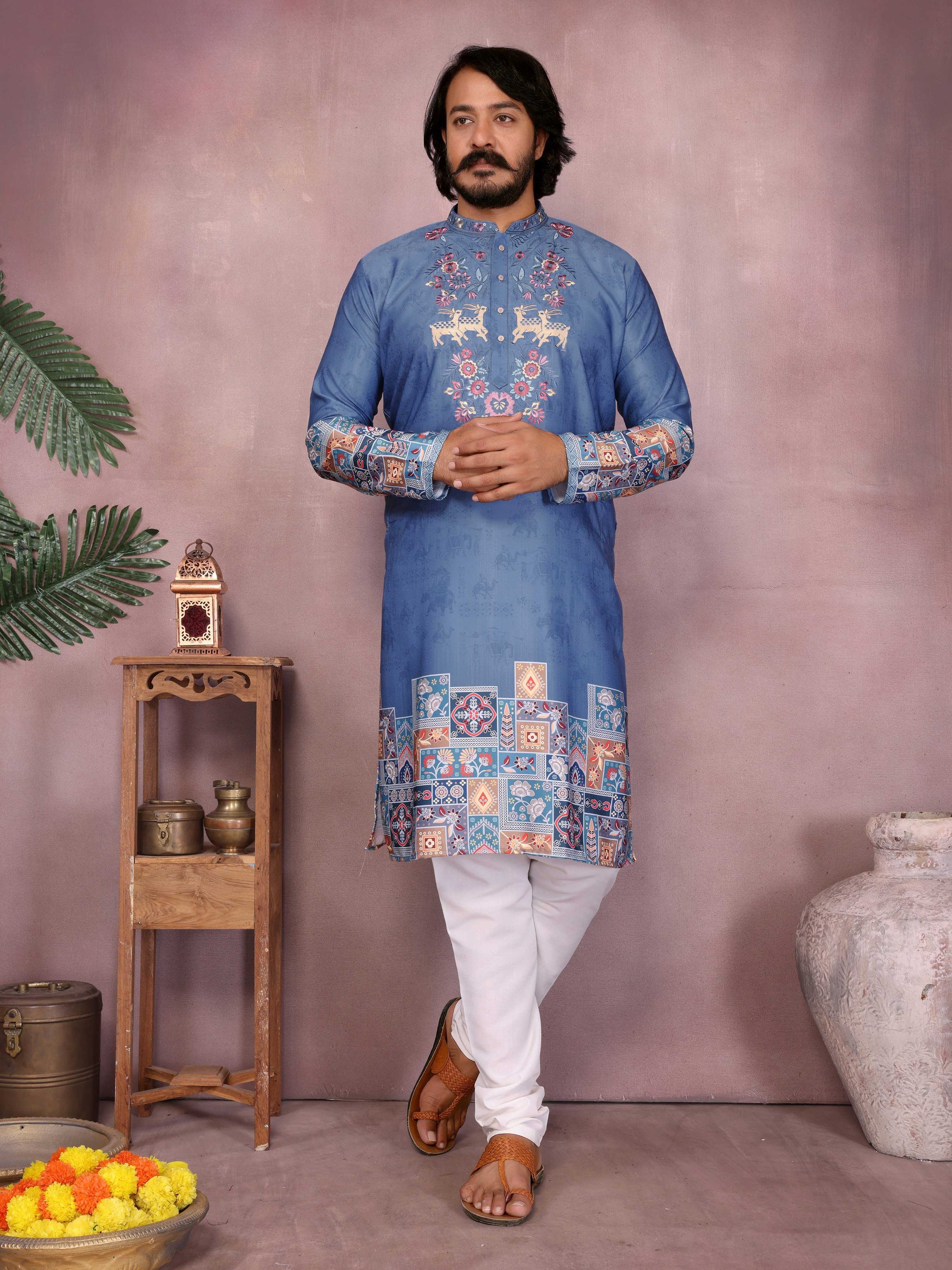 Men wearing a blue kurta with sequins embroidery paired with pajama pants
