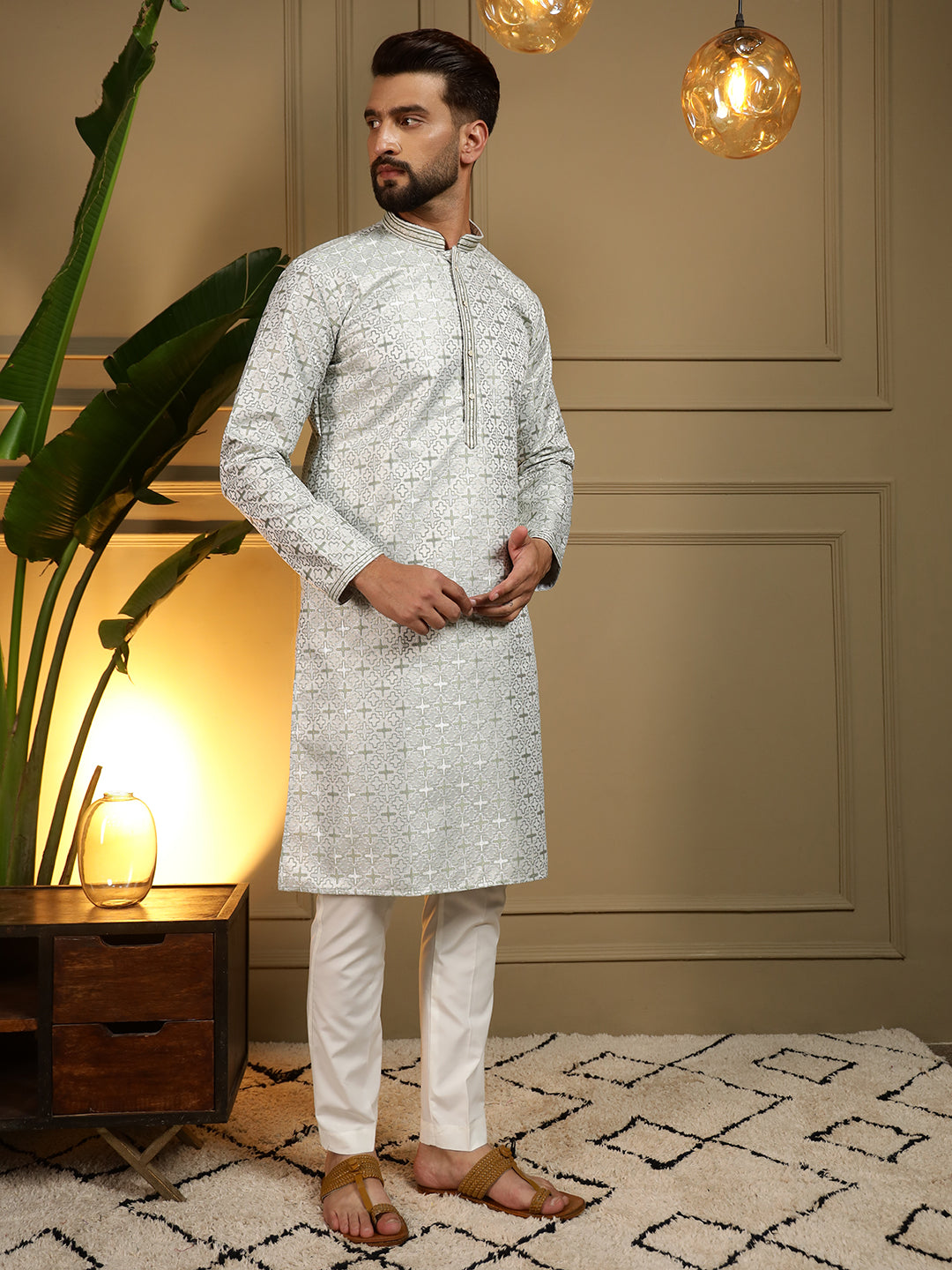 A man wearing a Mehendi green woven jacquard kurta with matching pajama set, featuring a straight knee-length design.