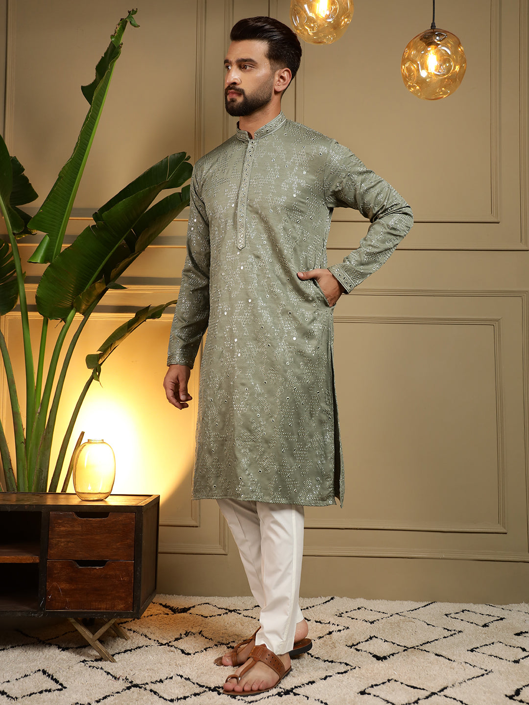 Toddler boy wearing a green knee-length kurta with mirror embroidery and matching pajama set