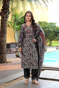 Woman wearing a black cotton silk floral printed designer kurta set with a matching dupatta