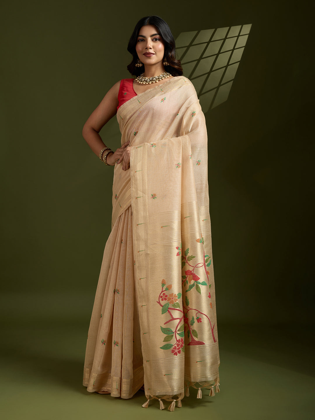 Elegant cream Muga cotton Paithani saree with gold Zari woven border and matching blouse piece.