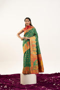 Green Banarasi pashmina soft silk saree featuring elegant gold zari weaving.
