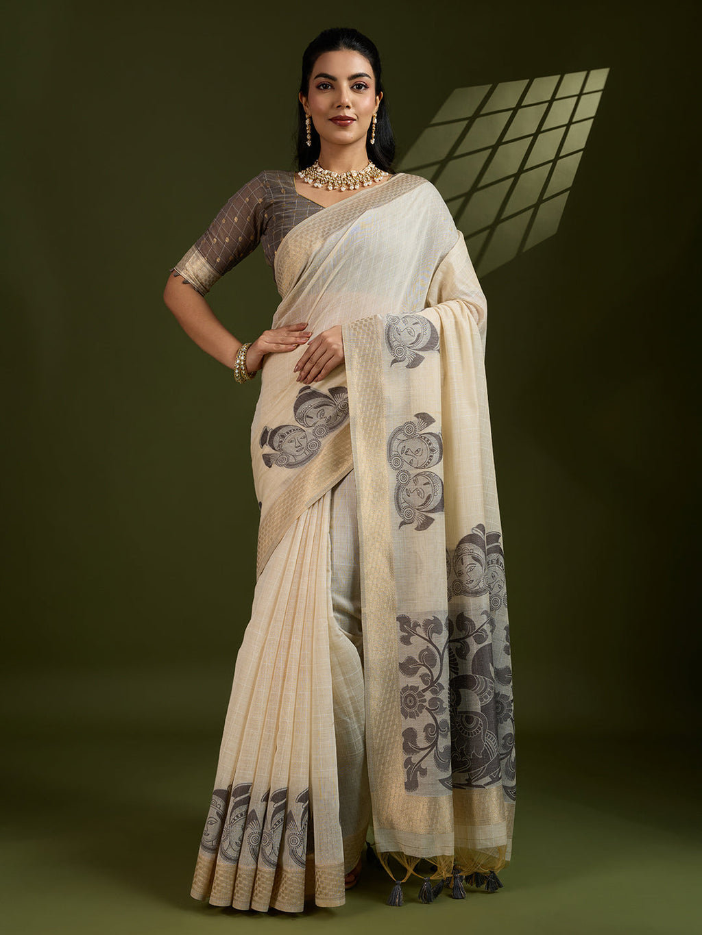 Coffee colored Muga cotton saree with traditional Kalamkari woven patterns and matching blouse