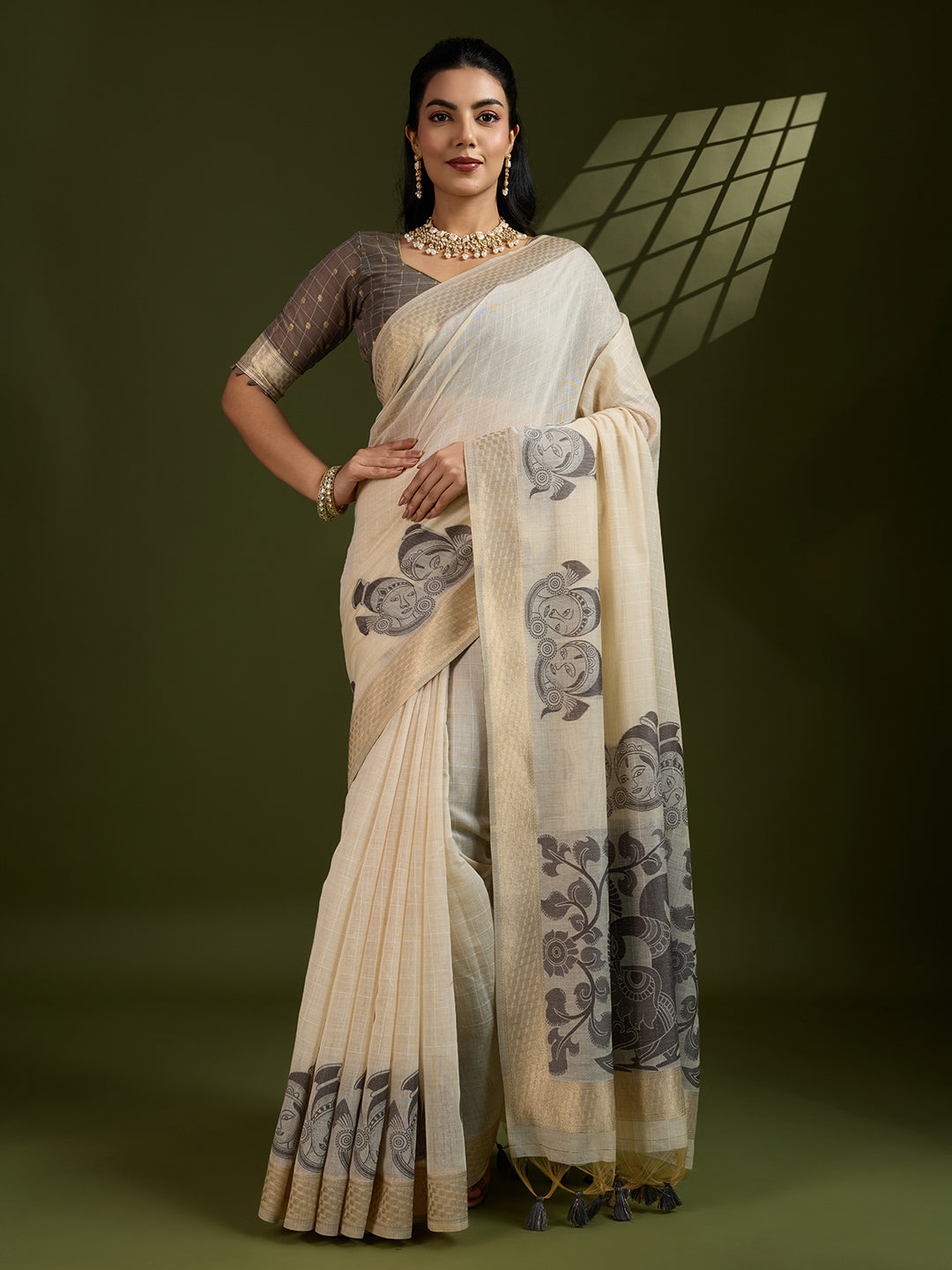 Coffee colored Muga cotton saree with traditional Kalamkari woven patterns and matching blouse
