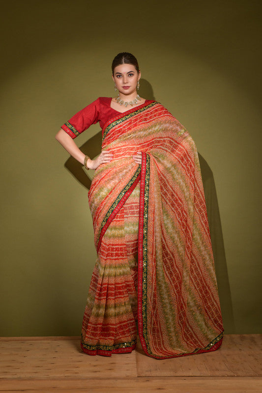 Red georgette saree featuring foil print and sequence work with a matching blouse.
