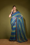 Blue georgette saree with foil print patterns and sequence detailing.