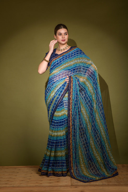 Blue georgette saree with foil print patterns and sequence detailing.