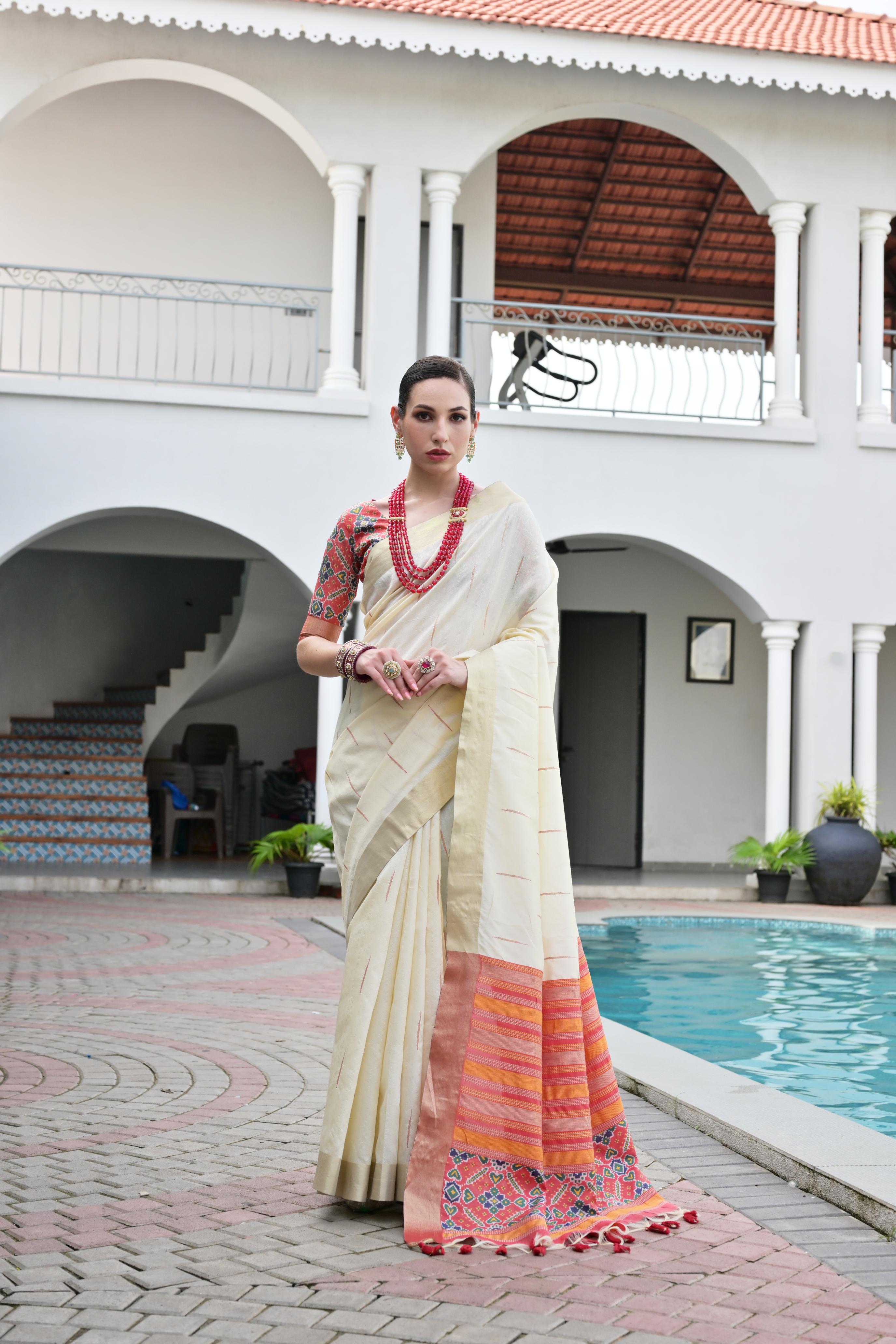Off White Khadi Raw Silk Saree with traditional Meena woven Patola patterns.