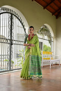 Green Khadi raw silk saree with traditional Meena weaving and Patola-inspired pattern.