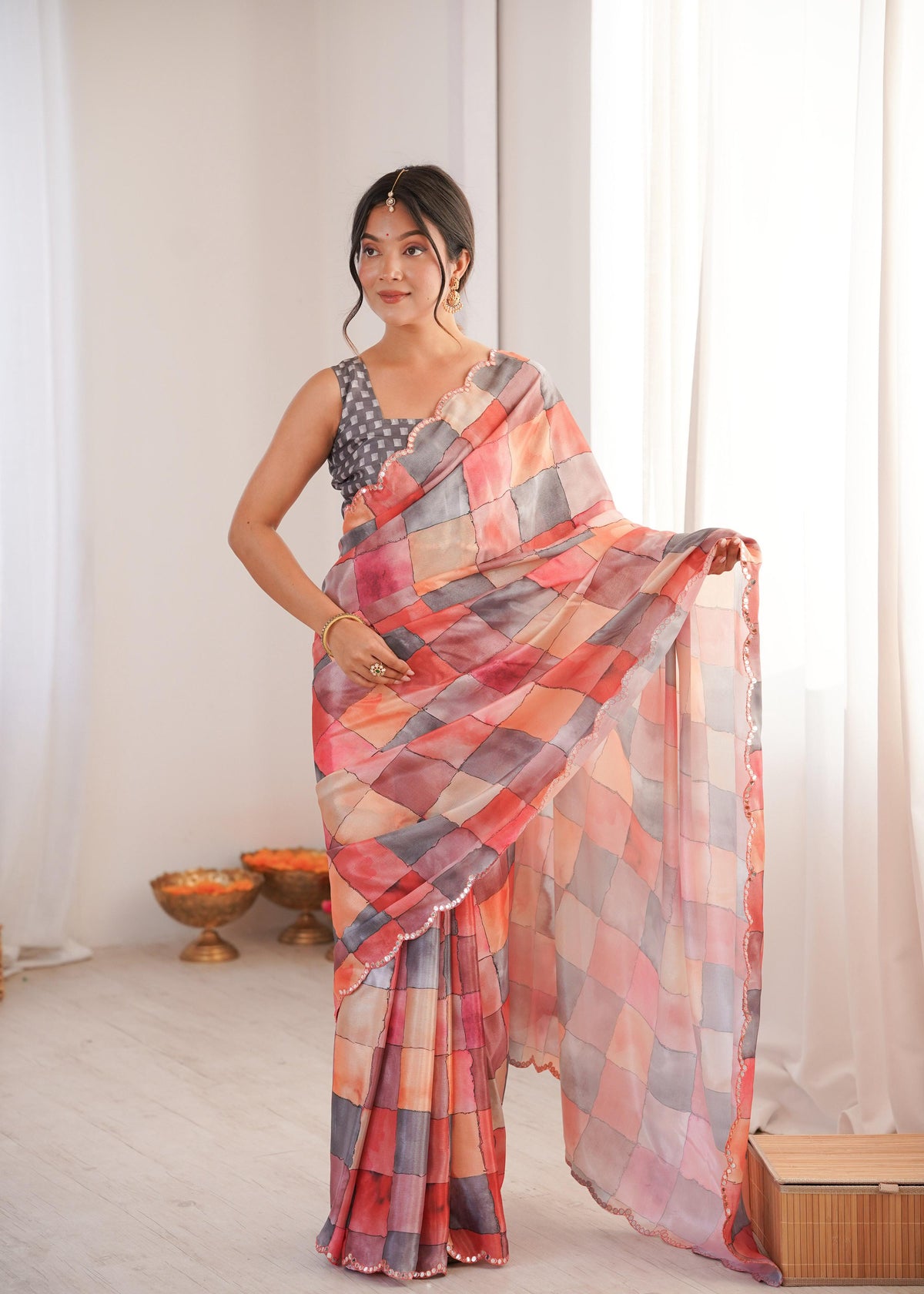 Elegant multicolor Chinon saree with digital prints and mirror lace border detailing.