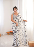 Sophisticated Off White Chinon saree featuring digital print and delicate mirror lace border