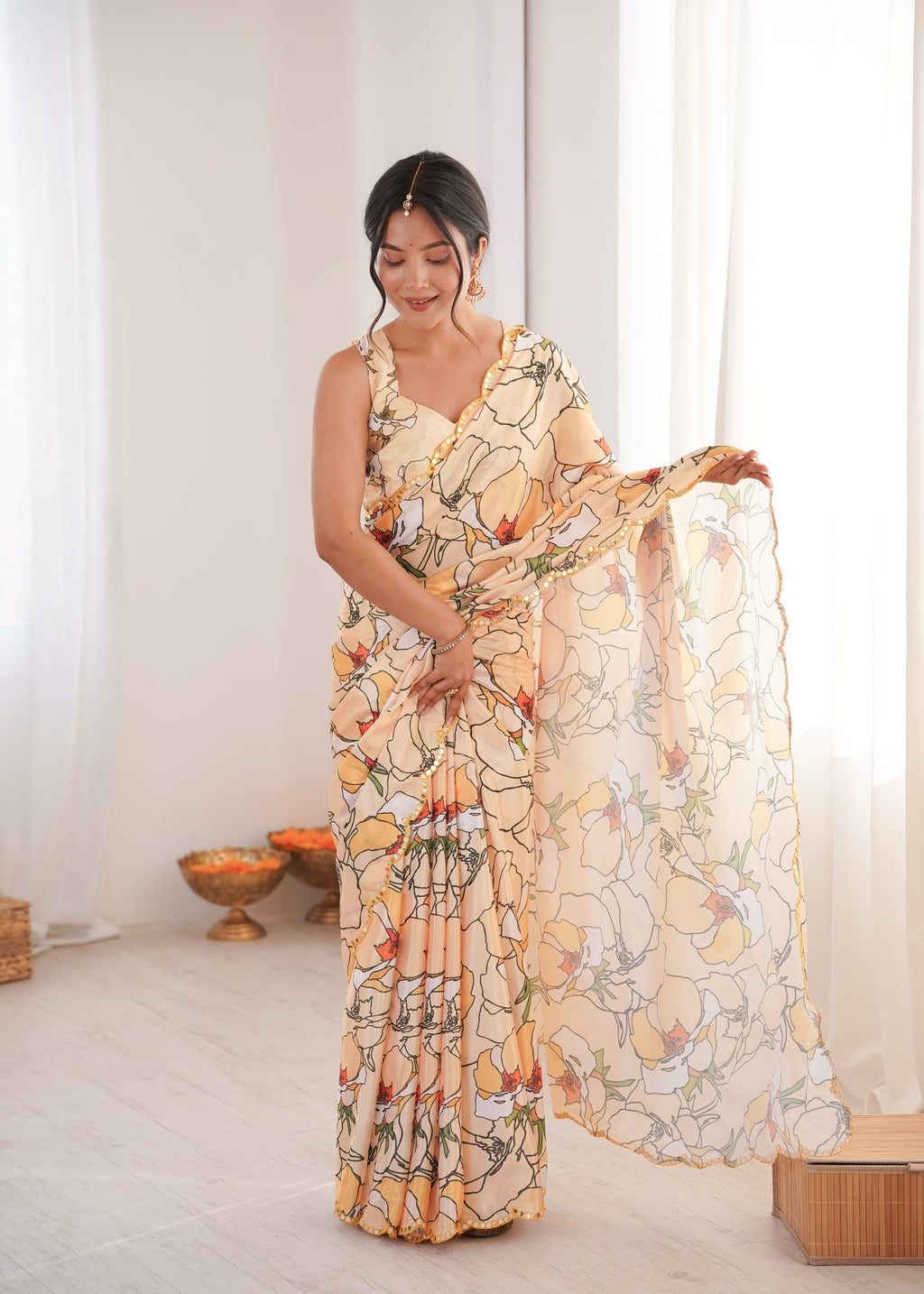 Elegant cream Chinon saree featuring intricate digital prints and a delicate mirror lace border.