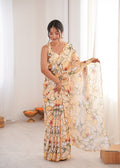 Elegant cream Chinon saree featuring intricate digital prints and a delicate mirror lace border.