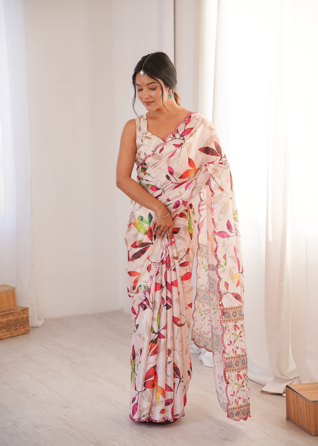 Women wearing a vibrant multicolor Chinon digital printed designer saree with detailed mirror lace border.