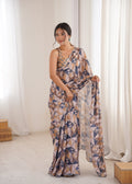 Women wearing a vibrant multicolor Chinon digital printed designer saree with detailed mirror lace border.