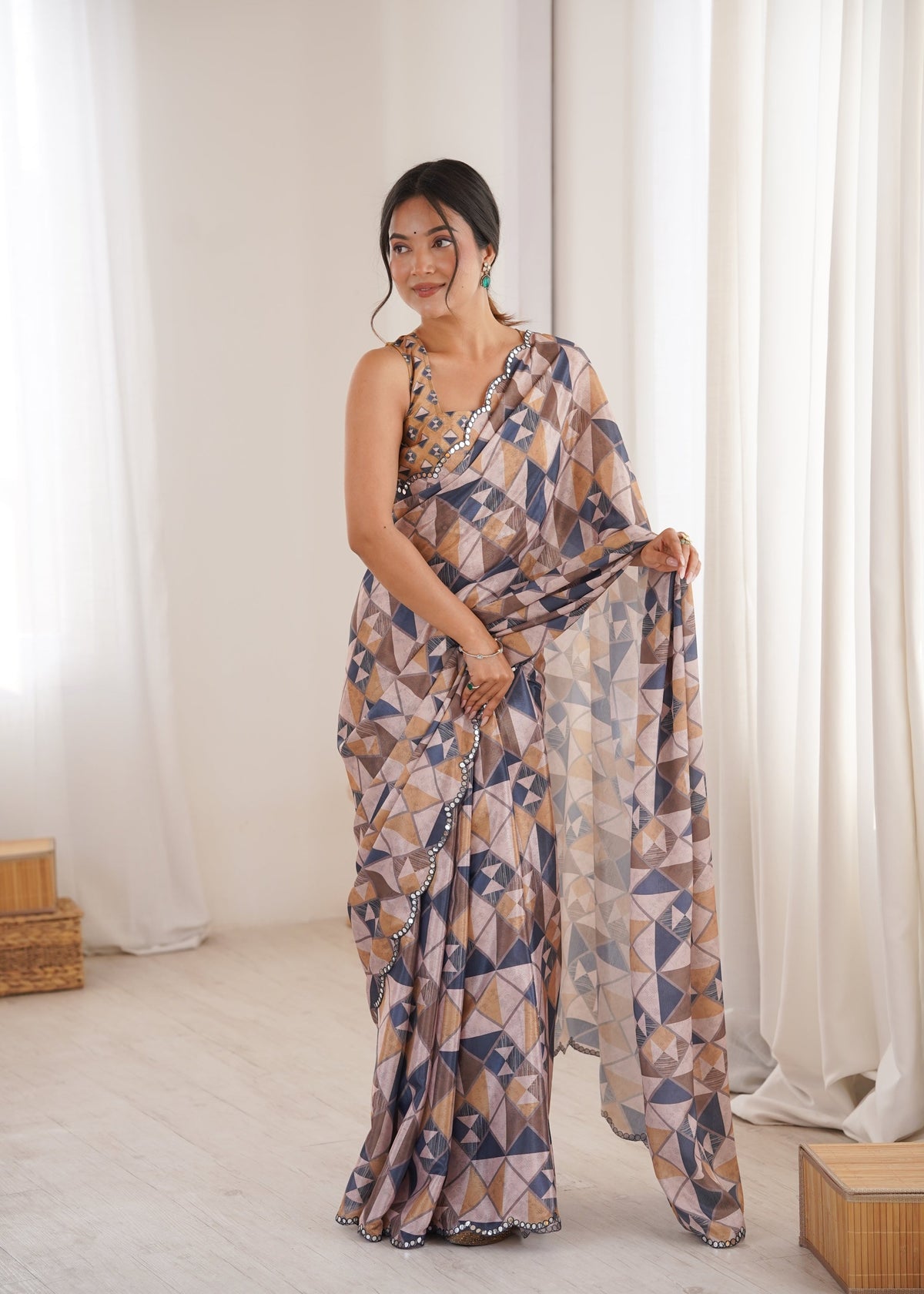 Women wearing a vibrant multicolor Chinon digital printed designer saree with detailed mirror lace border.
