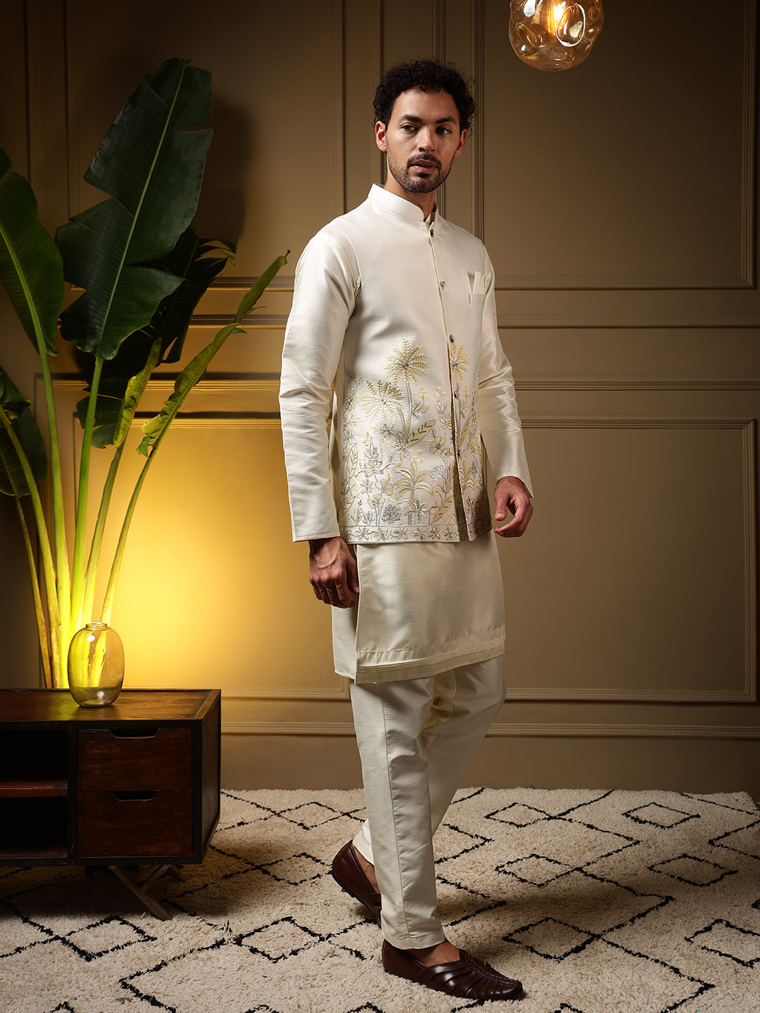 Front view of a men's yellow slub silk kurta set with sequin embroidery and matching koti