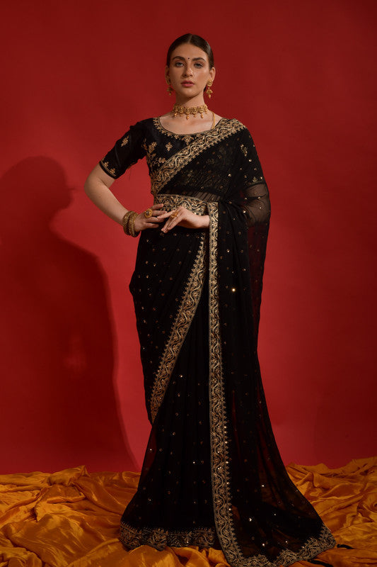 Black georgette saree with detailed coding sequence embroidery and a matching blouse.