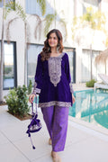 Front view of a purple velvet designer kurta with Zari coding embroidery and a matching Batwa bag.
