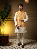 Man wearing a yellow slub silk jacquard kurta set with a matching koti, showcasing 3D weaving detail