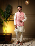 Men wearing a pink slub silk kurta set with a 3D jacquard koti jacket.