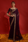 Wine-colored georgette saree with fine sequence coding embroidery.