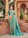 Teal Banarasi silk saree with gold zari woven patterns and traditional jhalar