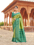 Green Soft Banarasi Silk saree with gold zari woven patterns and jhalar border