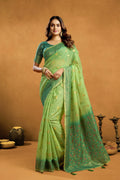 Elegant green premium spun cotton saree with gold zari weaving and jhalar border
