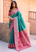 Turquoise silk saree with intricate Zari weave and Jhalar border