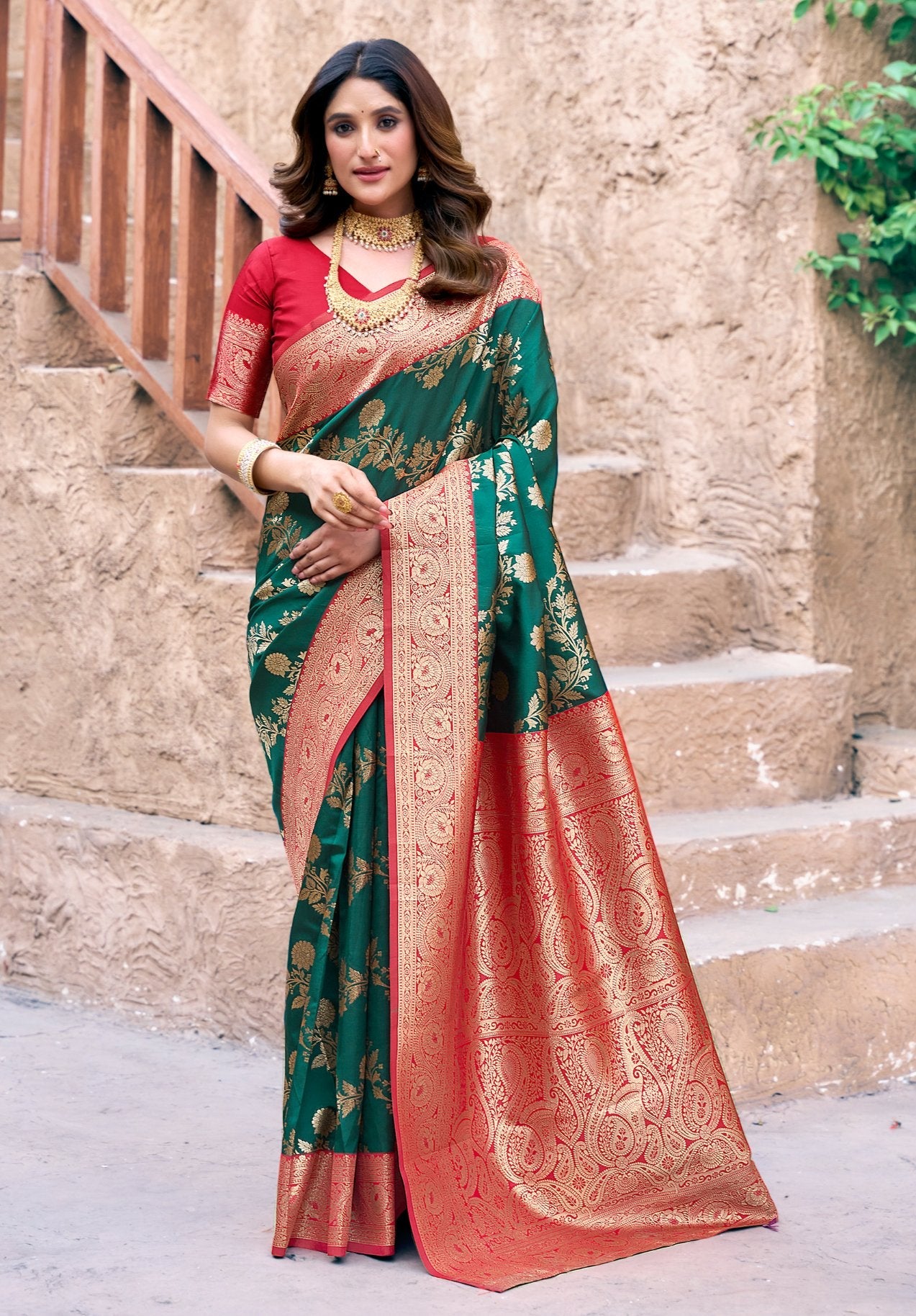 Bottle green silk saree with gold zari woven patterns and jhalar border with blouse piece.