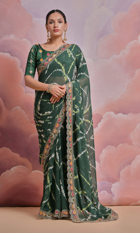 Bottle green georgette saree with coding sequence embroidery and matching blouse.
