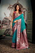 Turquoise soft silk saree with intricate zari weaving and decorative jhalar border
