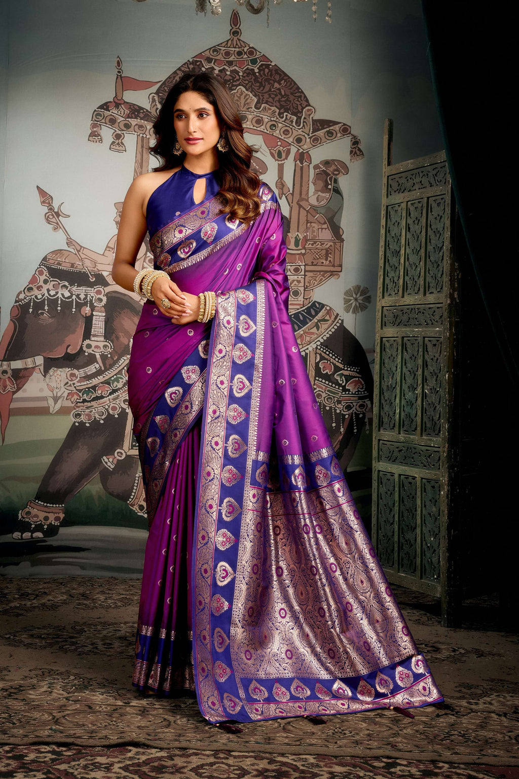 Purple soft silk saree with intricate gold Zari woven patterns and Jhallar border