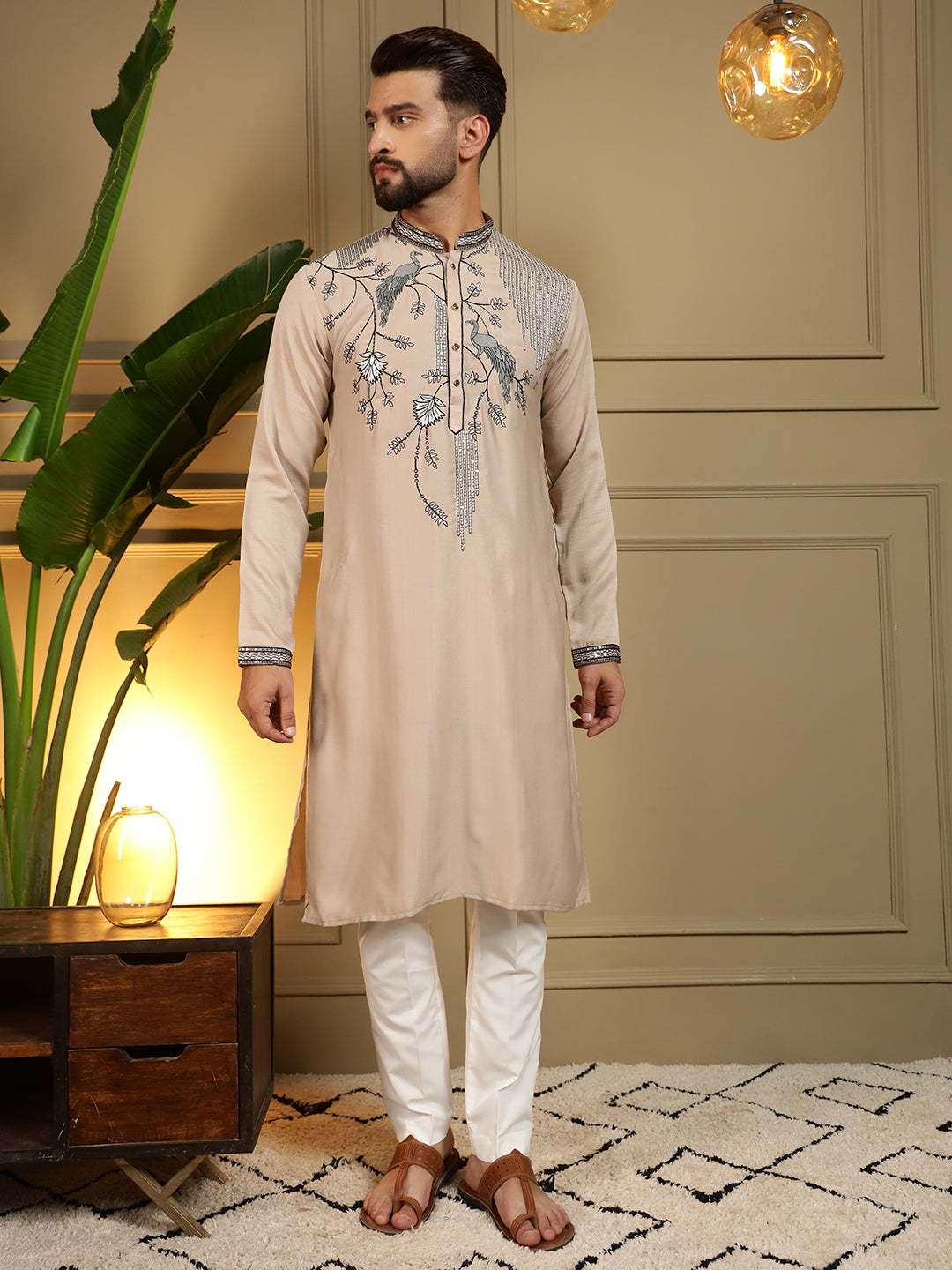 Man wearing a beige viscose silk kurta with sequins embroidery and matching pajama