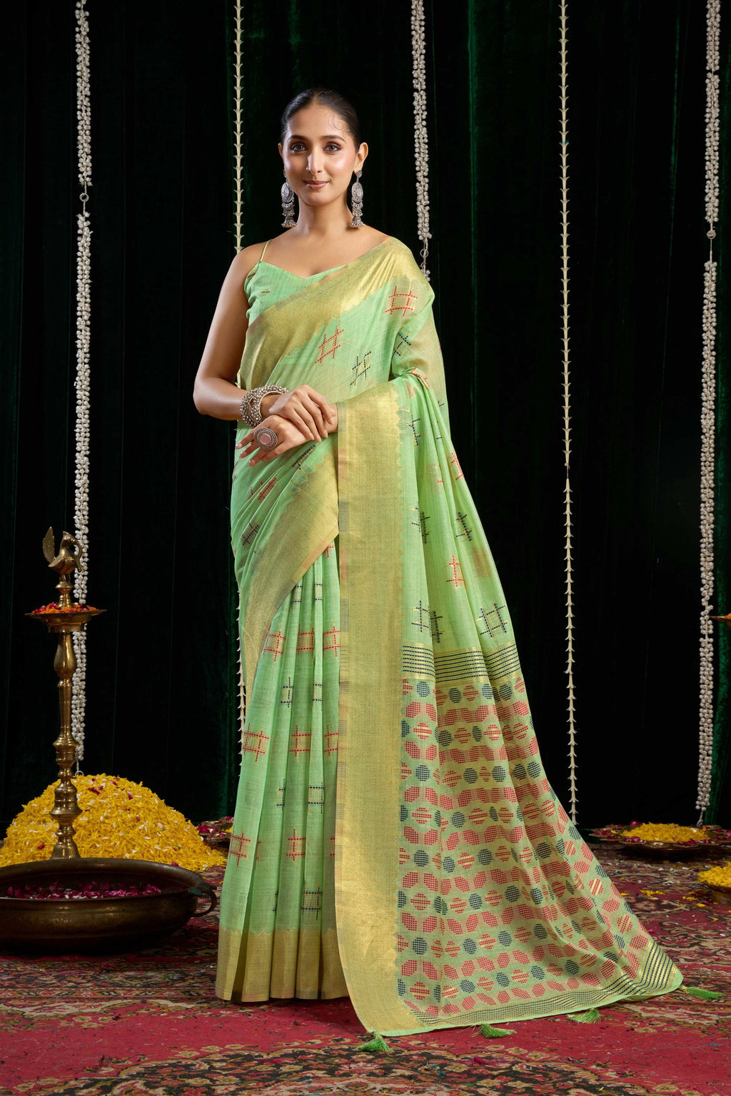 Green soft spun cotton saree with Zari woven border and jhalar