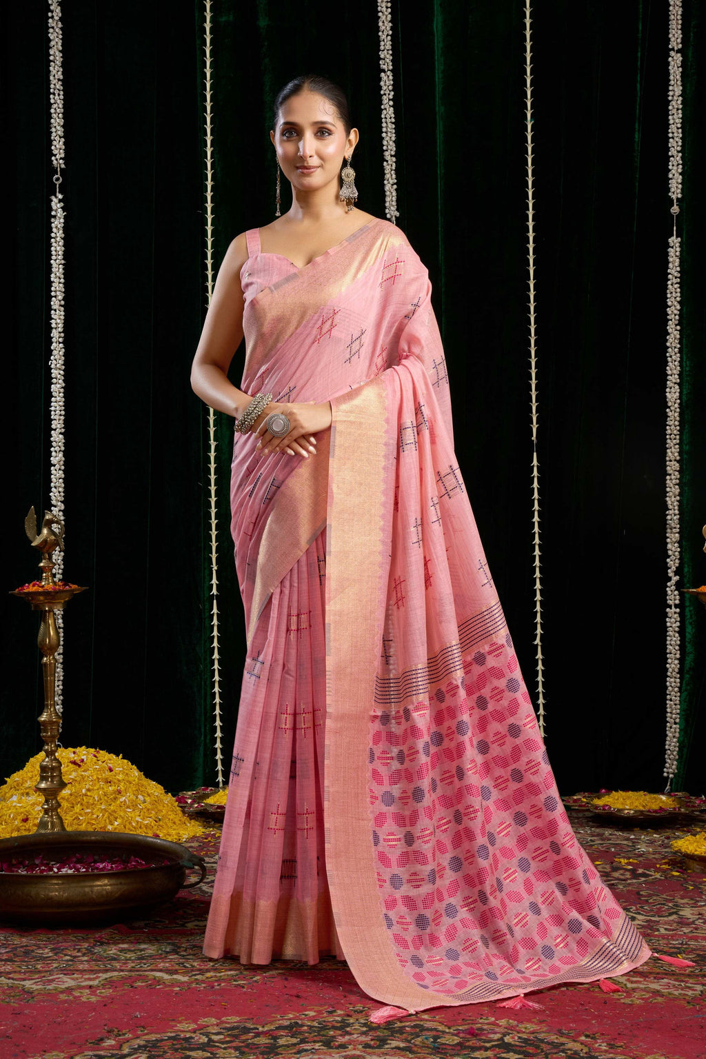 Pink soft spun cotton saree with Zari woven border and Jhalar, includes matching blouse.