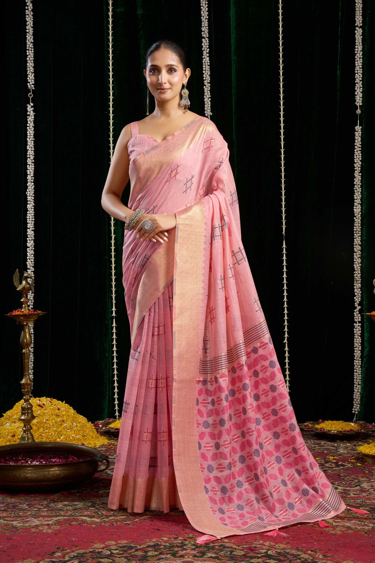 Pink soft spun cotton saree with Zari woven border and Jhalar, includes matching blouse.