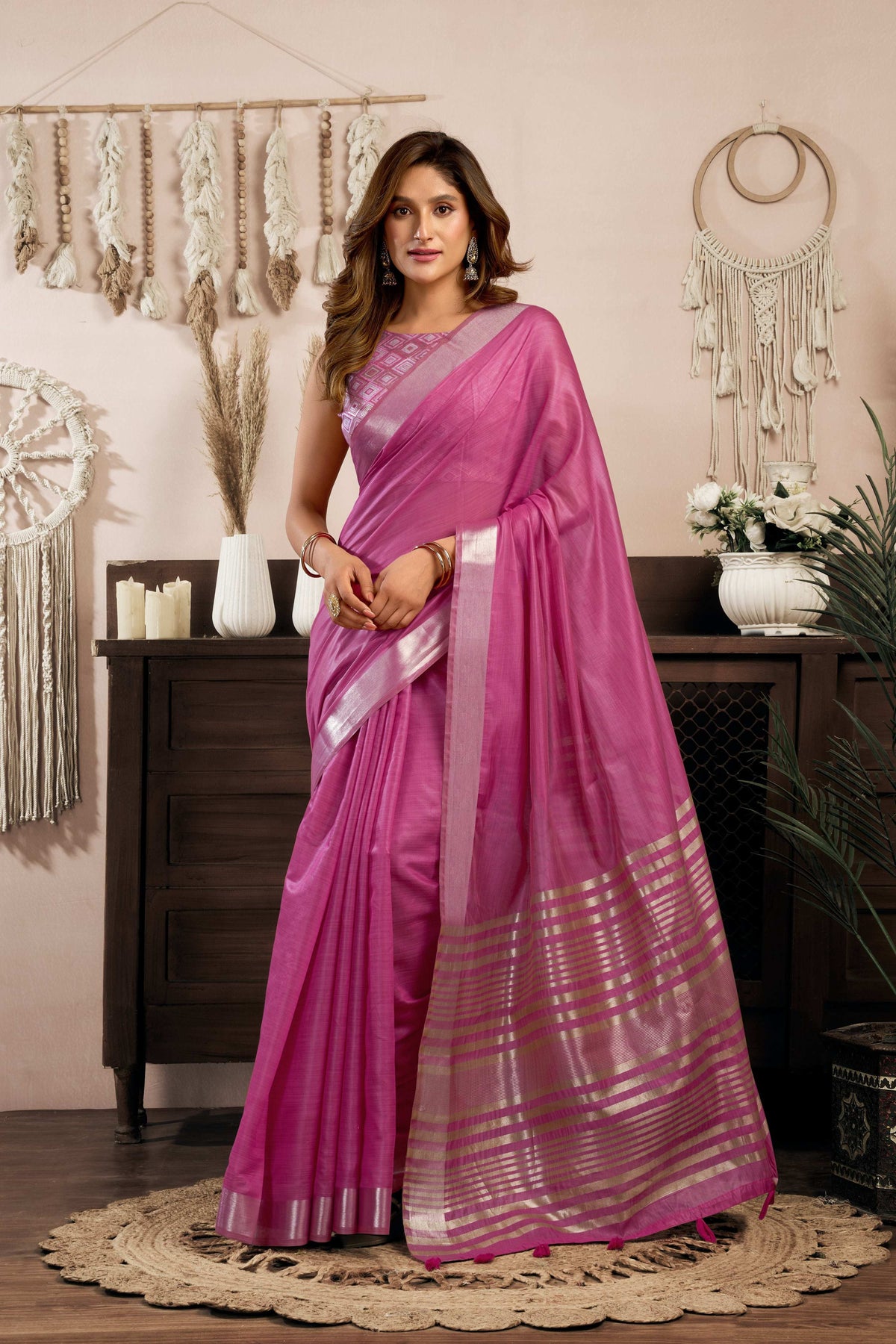 Magenta khadi cotton saree with metallic zari woven detailing and jhalar border.