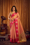 Peach soft tissue saree with woven zari border and decorative jhalar