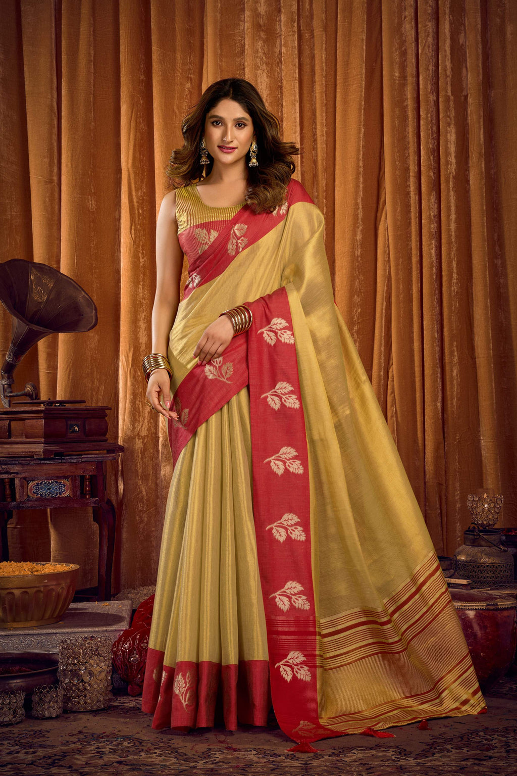 Pista green soft tissue saree with Zari woven border, includes matching blouse.