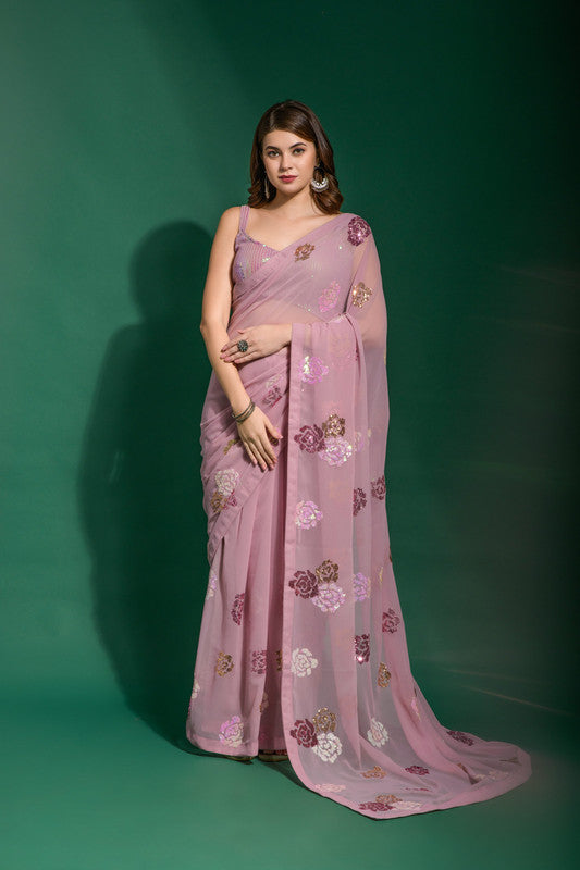 Pink georgette saree adorned with sequence work and matching blouse
