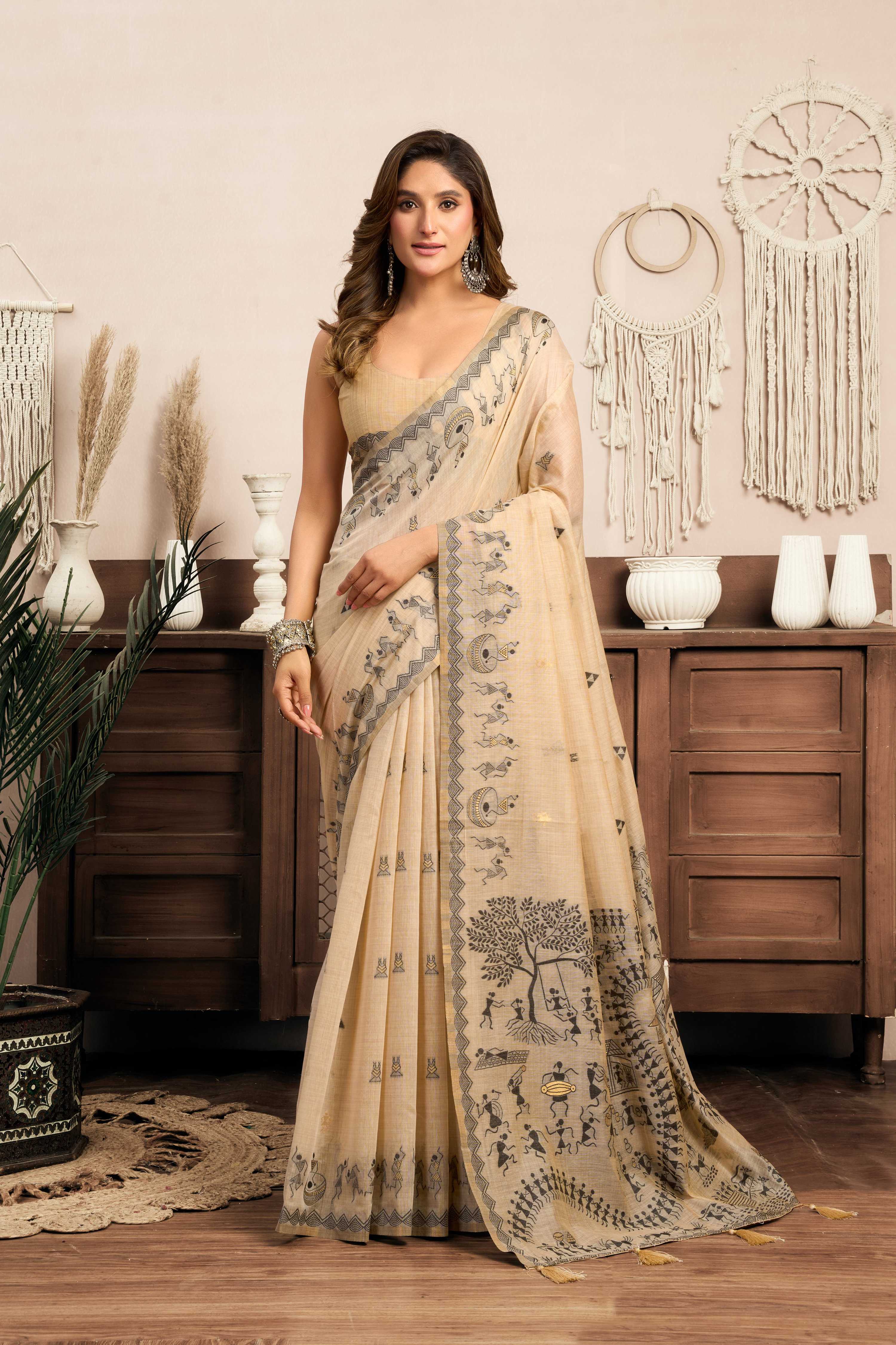 Cream Modal Art Silk saree with traditional Warli work print and Jhallar edge detail