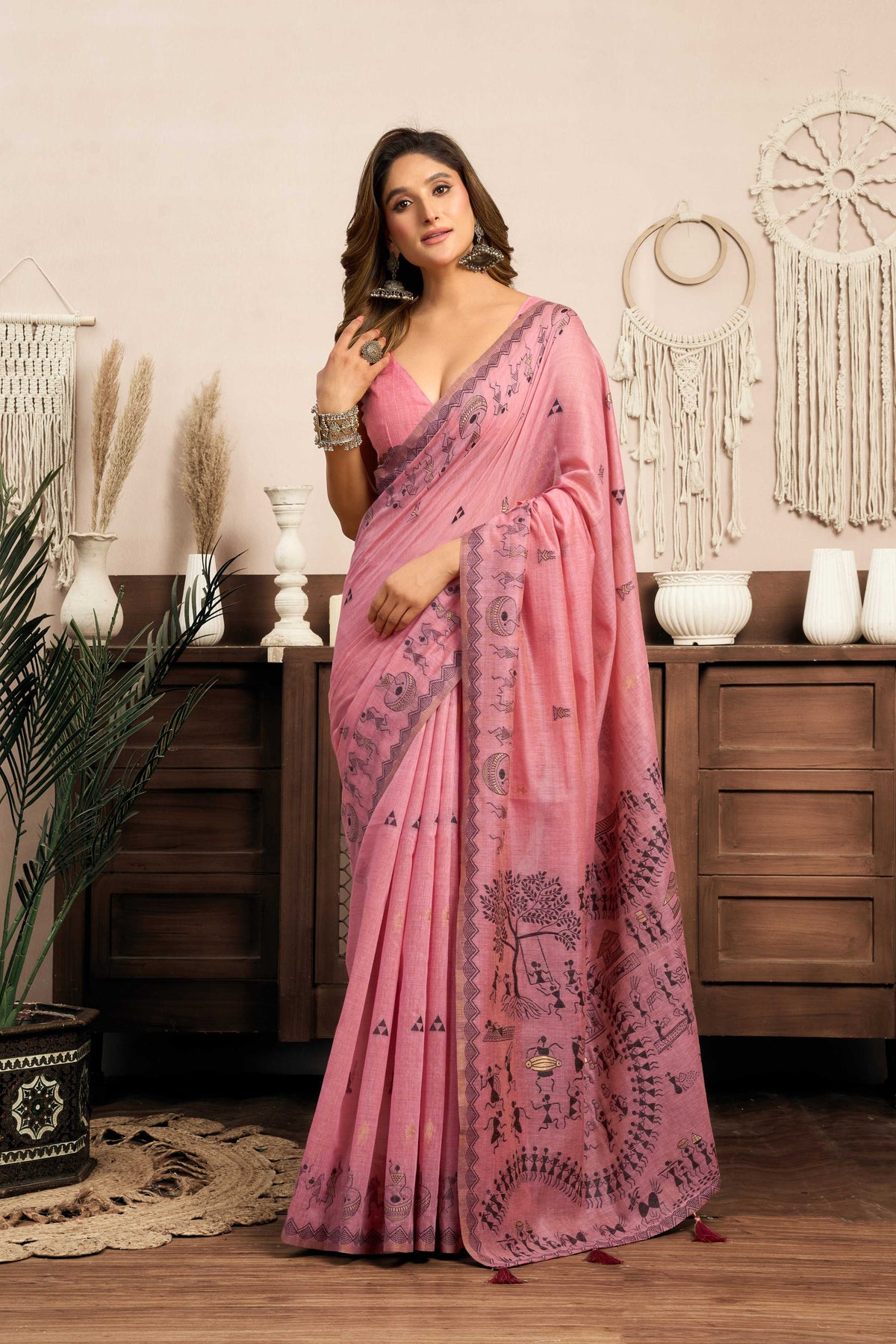Pink Modal Art Silk saree featuring Warli print and Jhallar border detail