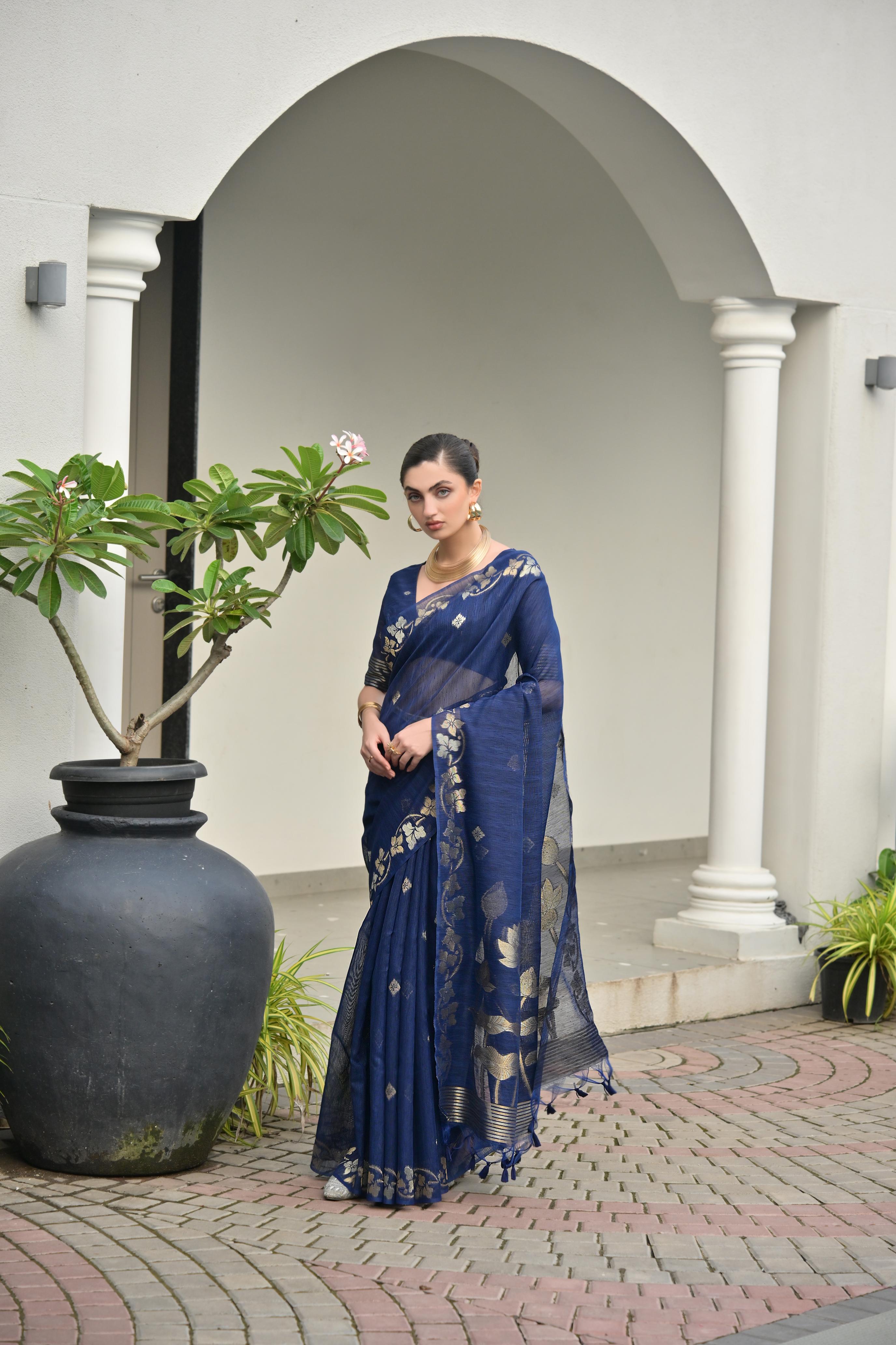 Elegant Navy Blue Soft Jute Linen Silk Saree with intricate gold zari weaving and matching blouse piece.