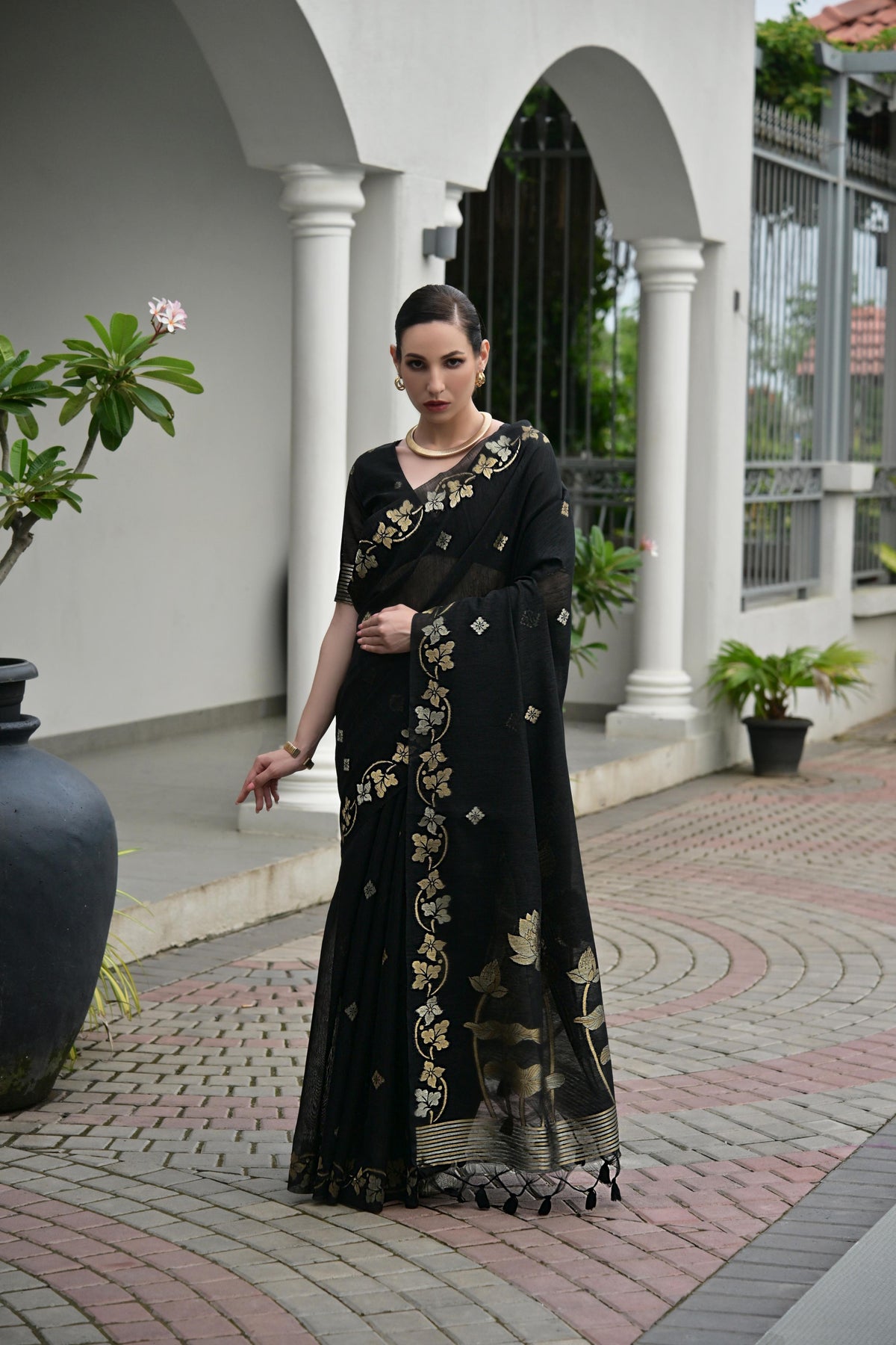 Black soft jute linen silk saree with Zari woven details and matching blouse